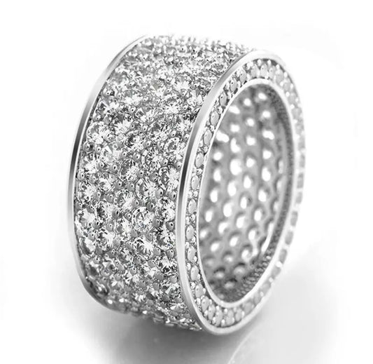 Zirconmania sterling silver eternity ring with pavé diamond simulants, multi-row band, shimmering on white background.