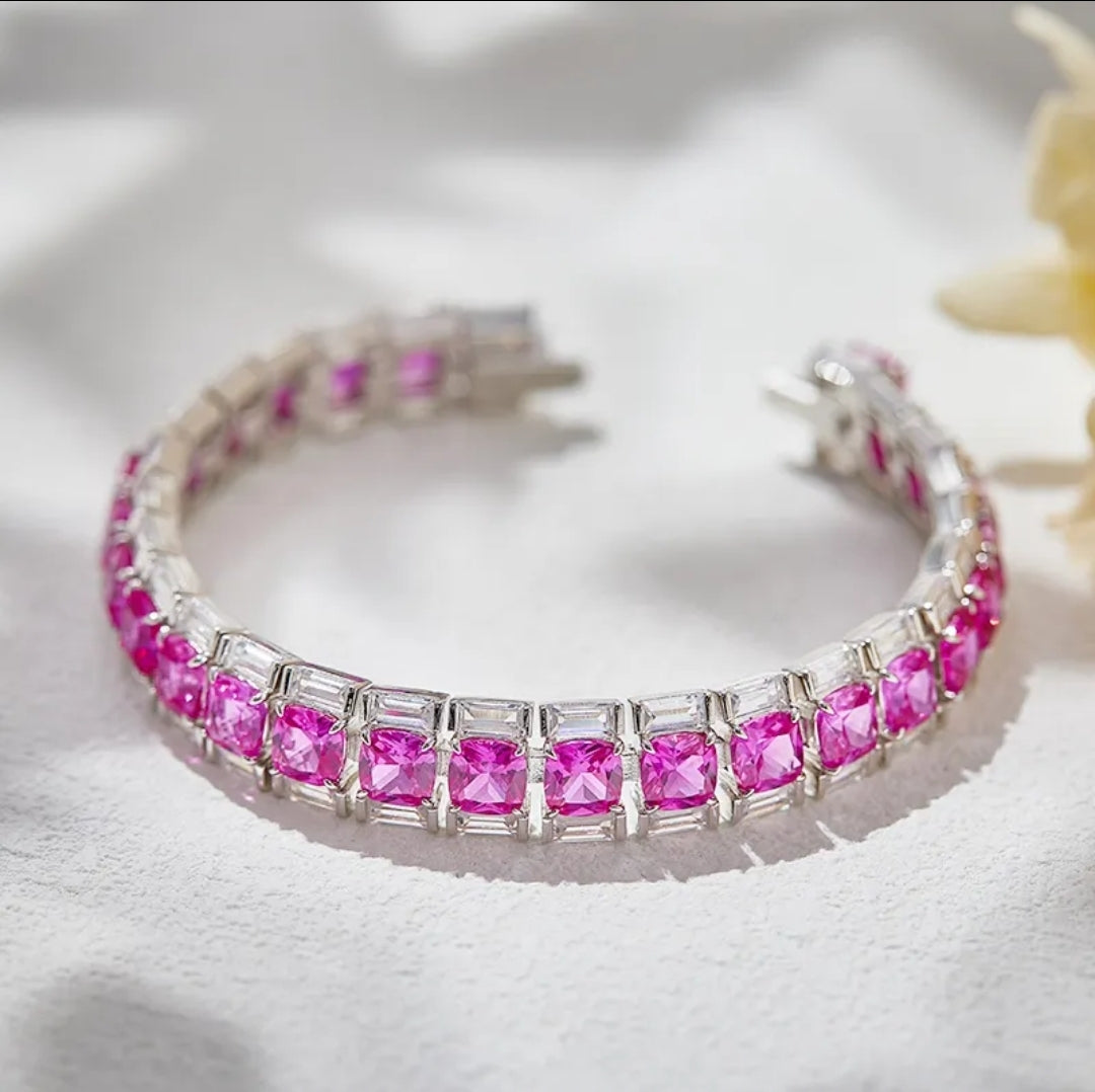 Zirconmania bracelet features baguette and cushion-cut pink zirconite stones, showcasing a unique, elegant tennis design.