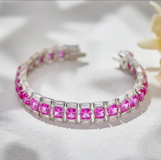 Luxury pink cushion zirconite tennis bracelet with double rows, elegant pattern, soft shadows, and yellow flower accent.