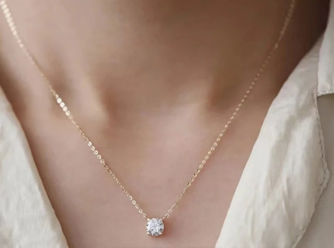 Round cubic zirconia solitaire pendant, worn on model, 635P100M