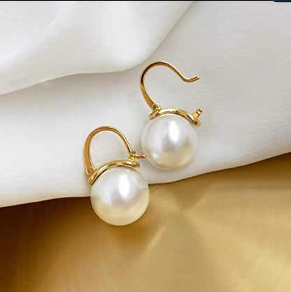 White pearl and cubic zirconia earrings by Zirconite, worn on model, 826E3092