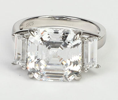10 CT Asscher-cut cubic zirconia three-stone ring in sterling silver, close-up view, 801R9061