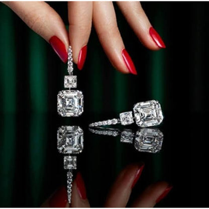 10 CT TW Asscher-cut cubic zirconia drop earrings in sterling silver, held in hand, 800E201