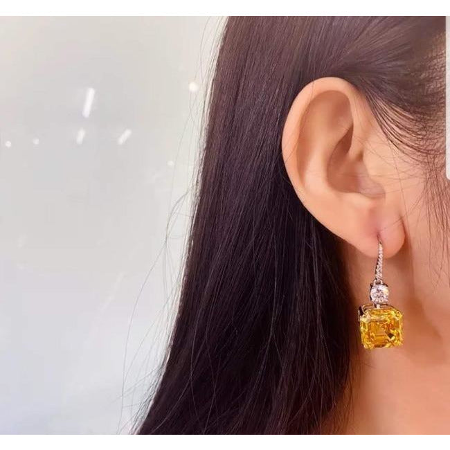 10 CT TW Asscher-cut cubic zirconia drop earrings in sterling silver, worn on model, 800E201