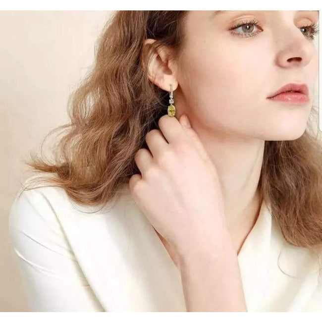 12 CT TW oval cubic zirconia drop earrings in sterling silver, worn on model, 800E202