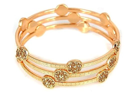 Zirconmania’s crystal-accented bangles in gold, rose gold, and silver blend luxe materials with elegant, modern design.