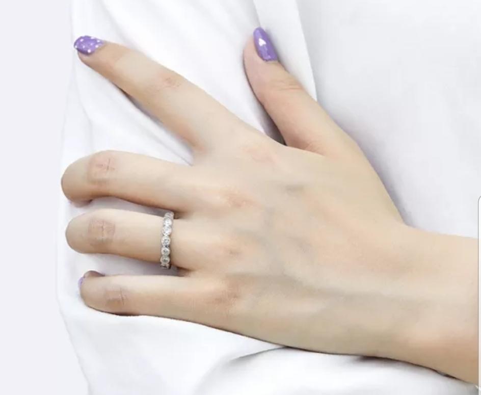 Bezel-set cubic zirconia eternity band ring, worn on model, 635RBEZEL