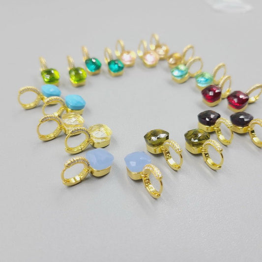 Cabochon huggie hoop earrings by Zirconite, group view, 827E100