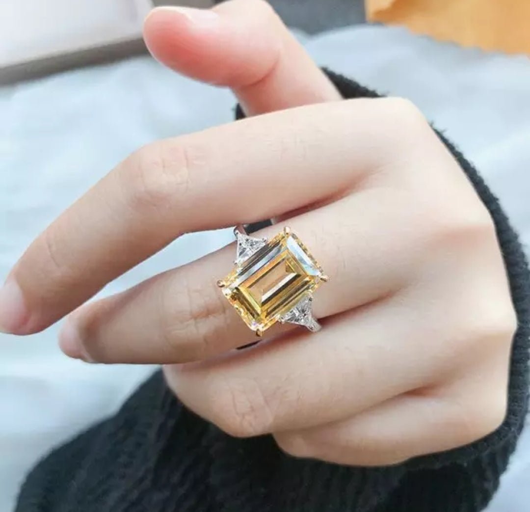 Canary radiant-cut cubic zirconia three-stone ring with trillion side stones in sterling silver, worn on hand, 635R72098