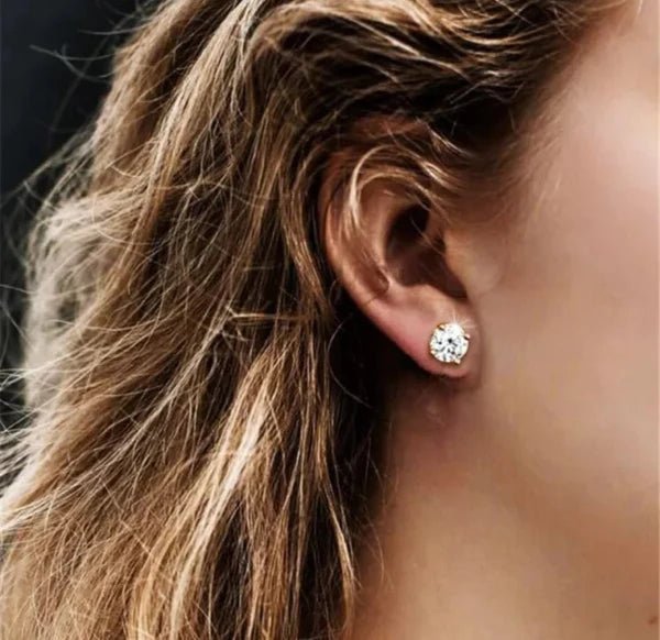 Round cubic zirconia stud earrings in 14K gold, worn on model, 635E14K